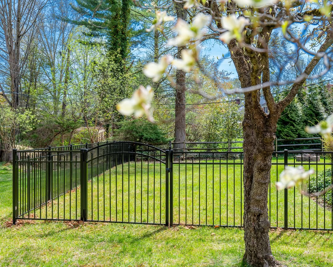 Full view of arched black aluminum fence in Delaware