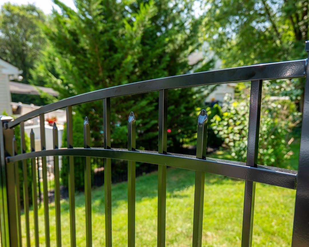 Gate detail of arched black aluminum gate in Delaware