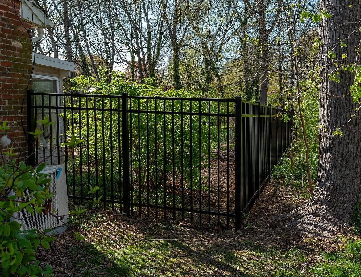 Open gate view of black aluminum fence in Wilmington, DE