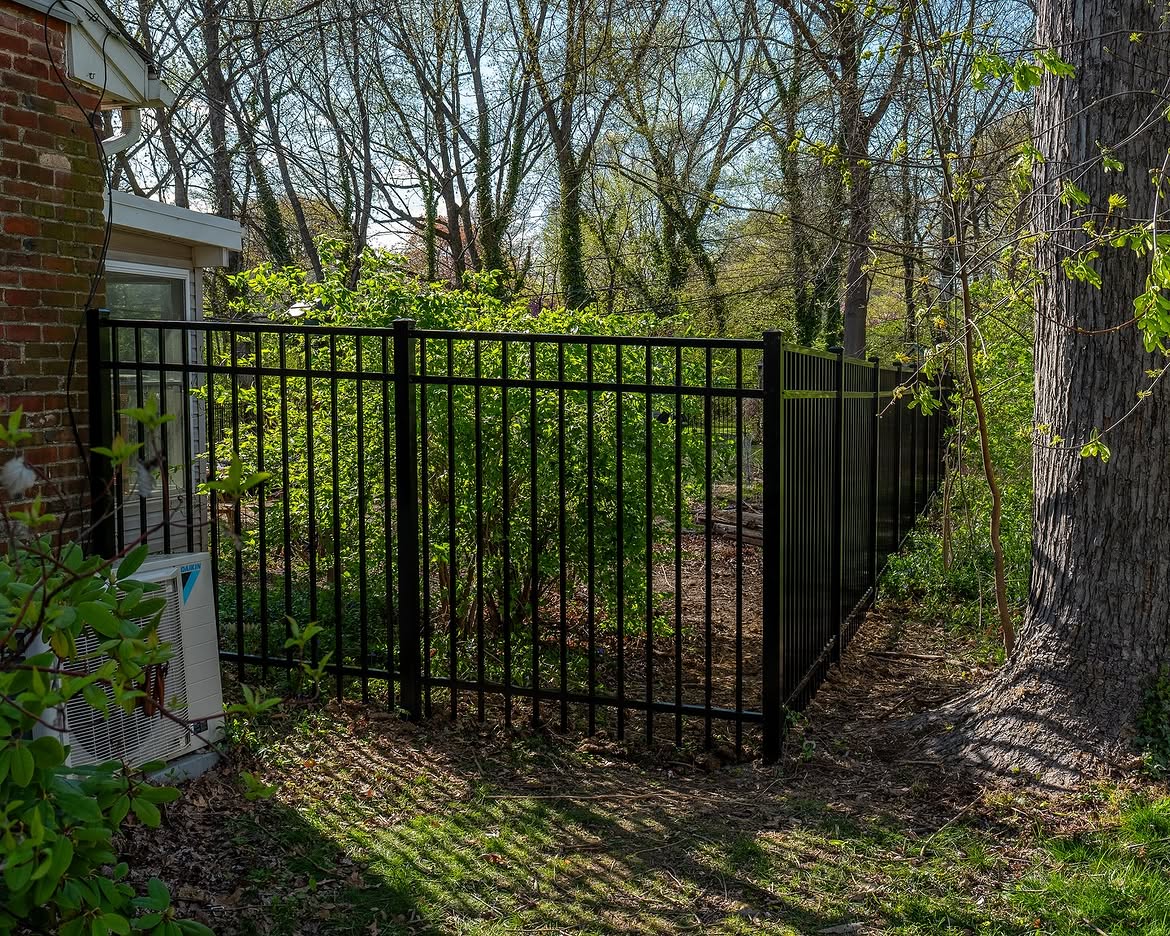 Open gate view of black aluminum fence in Wilmington, DE
