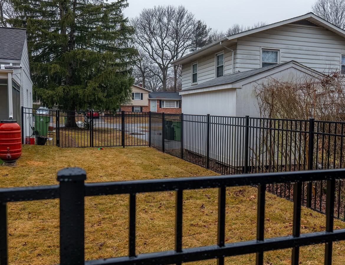 Property line view of black aluminum fence in Newark, DE