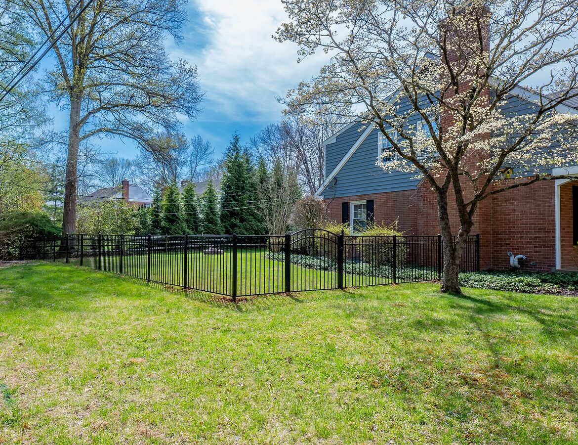 Property line view of black aluminum fence in North Wilmington, DE