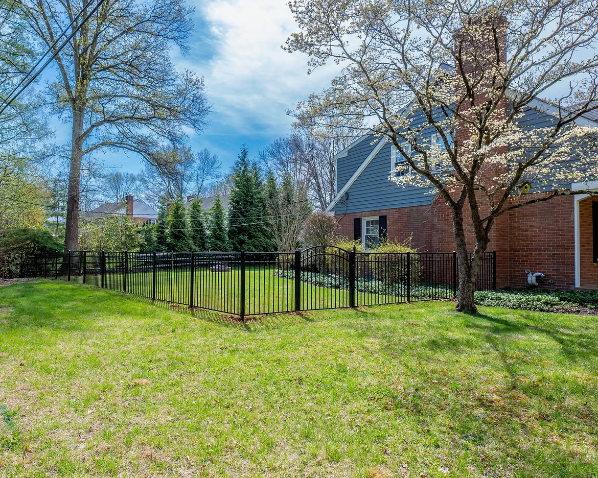 Property line view of black aluminum fence in North Wilmington, DE