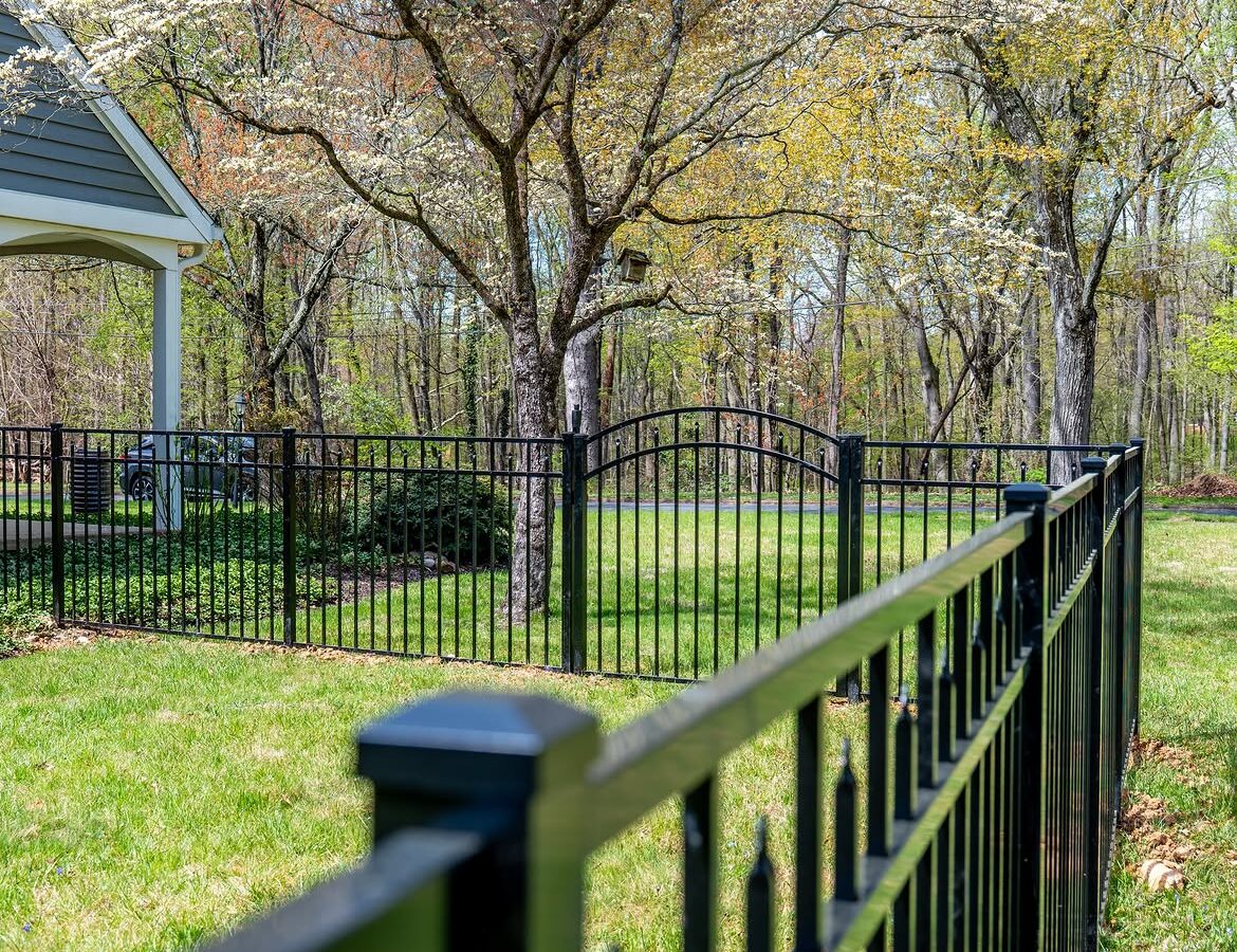 Open gate view of black aluminum fence in North Wilmington, DE
