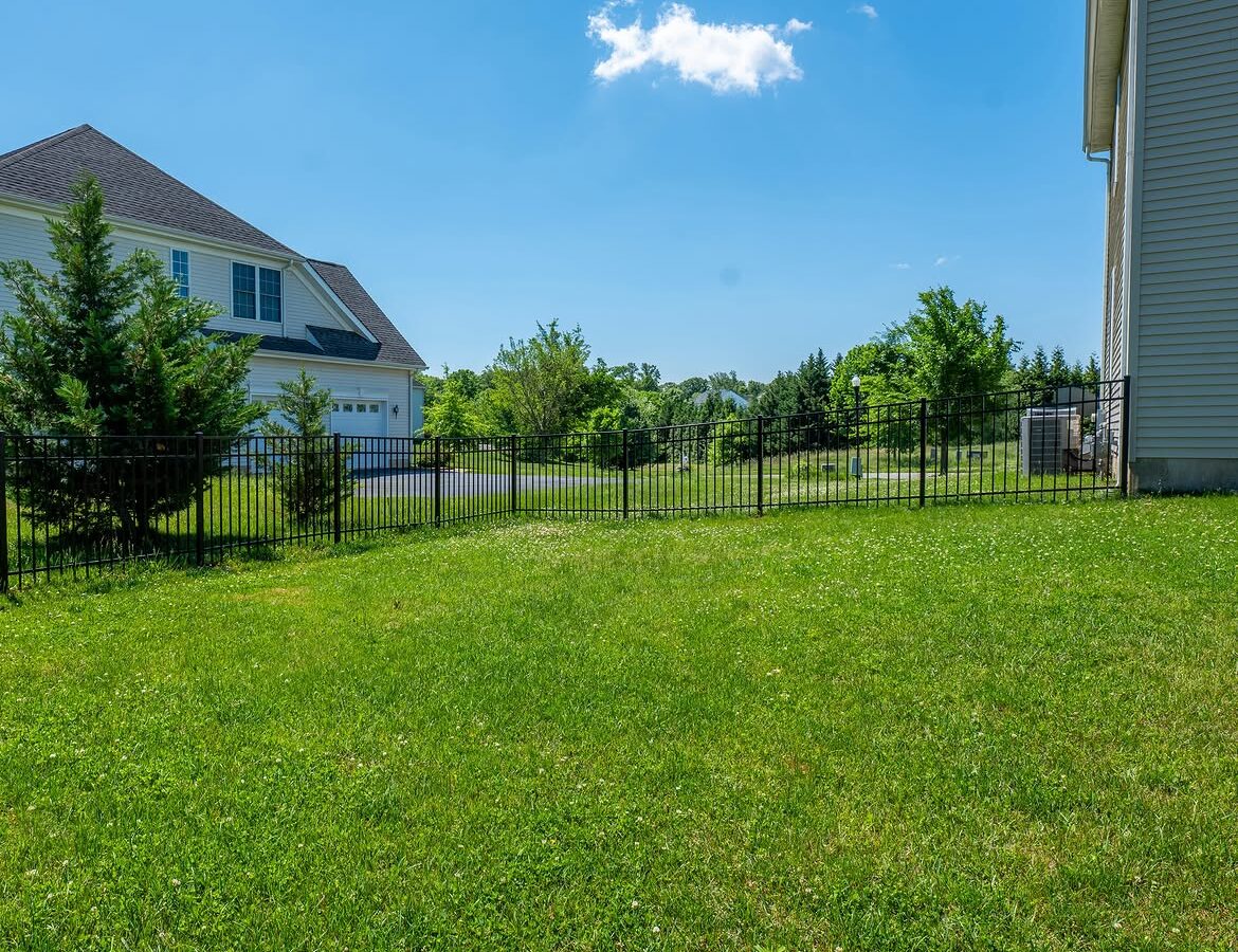 Angled view of black aluminum fence in Delaware