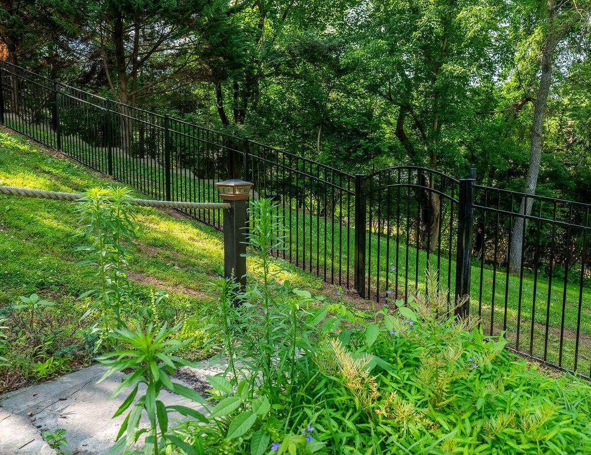 Wide view of black aluminum fence in Delaware