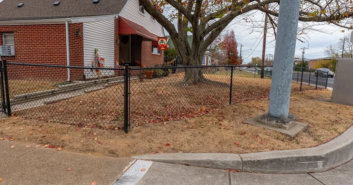 Angled view of black chain link fence in Delaware