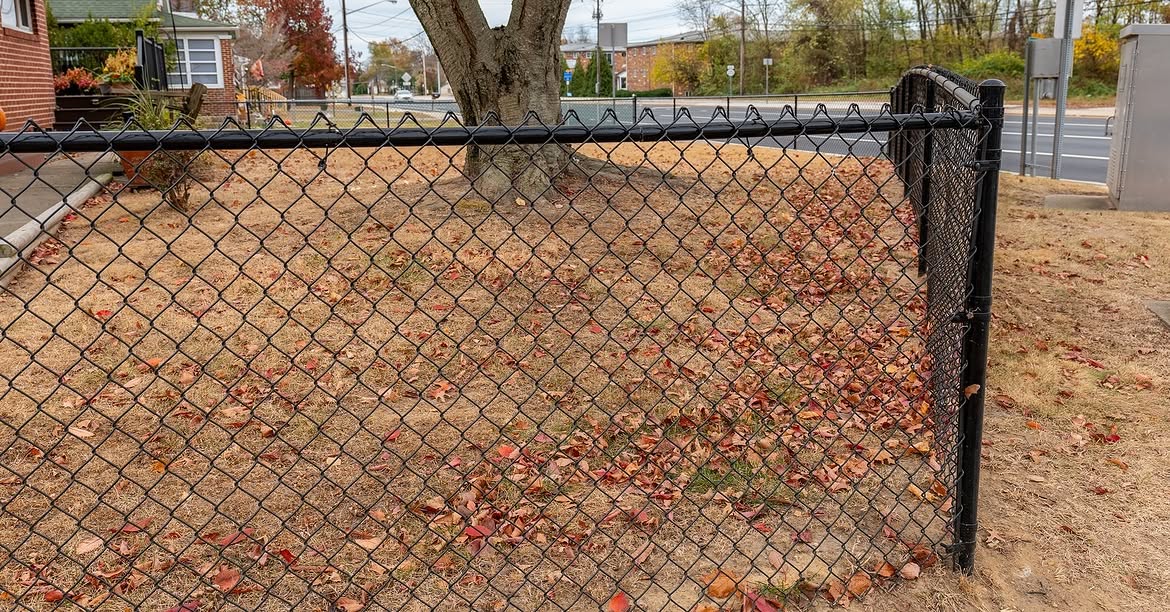 Corner detail of black chain link fence in Delaware