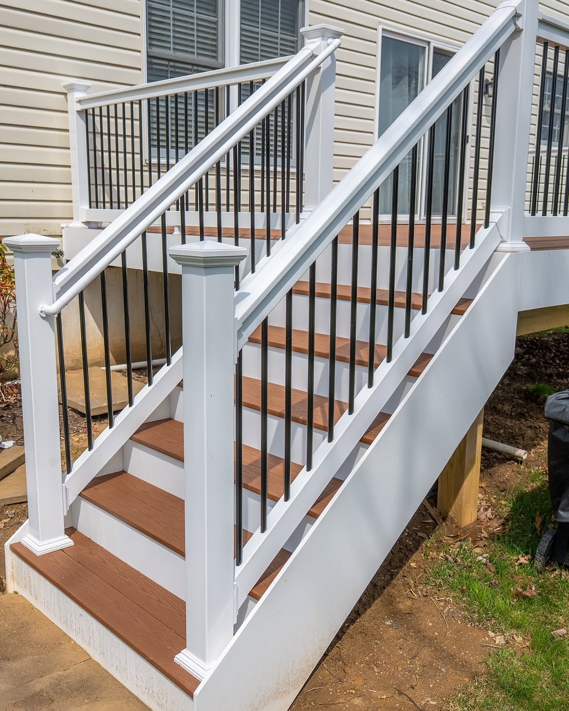 Wide view of composite deck with white rails in Delaware
