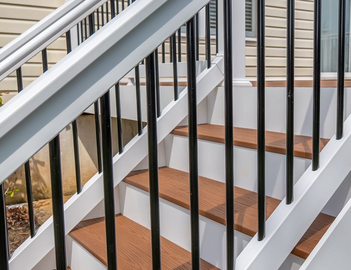 Rear yard view of composite deck with white rails in Delaware