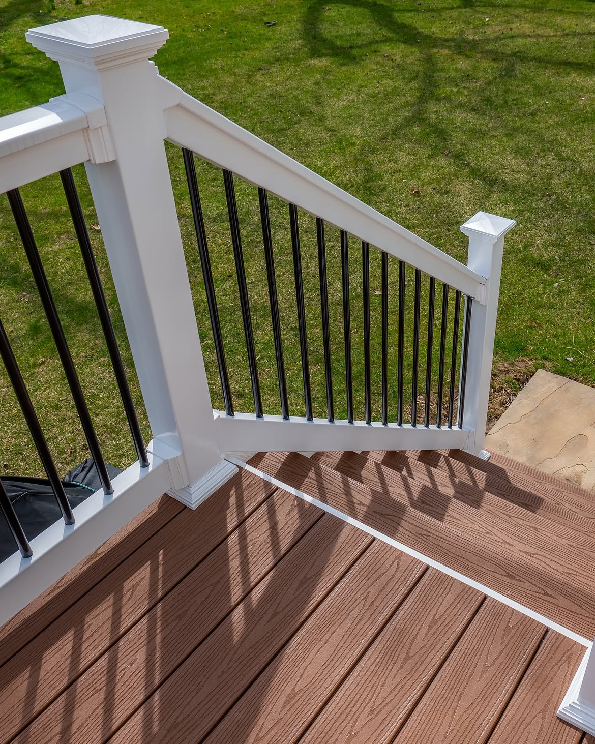 Curbside view of composite deck with white rails in Delaware