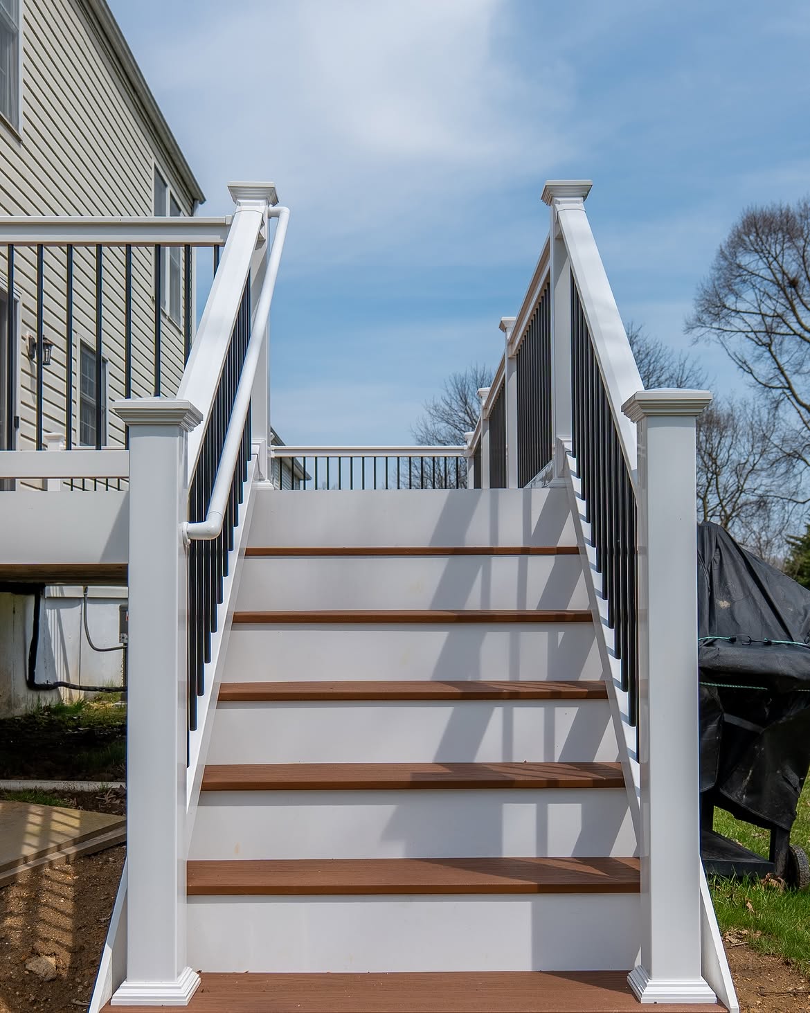 Angled view of composite deck with white rails in Delaware