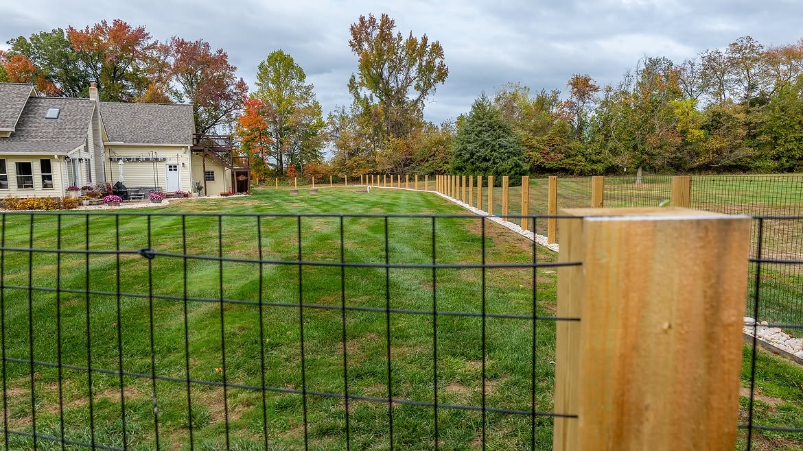 Corner detail of custom wire fence on cedar posts in Townsend, DE