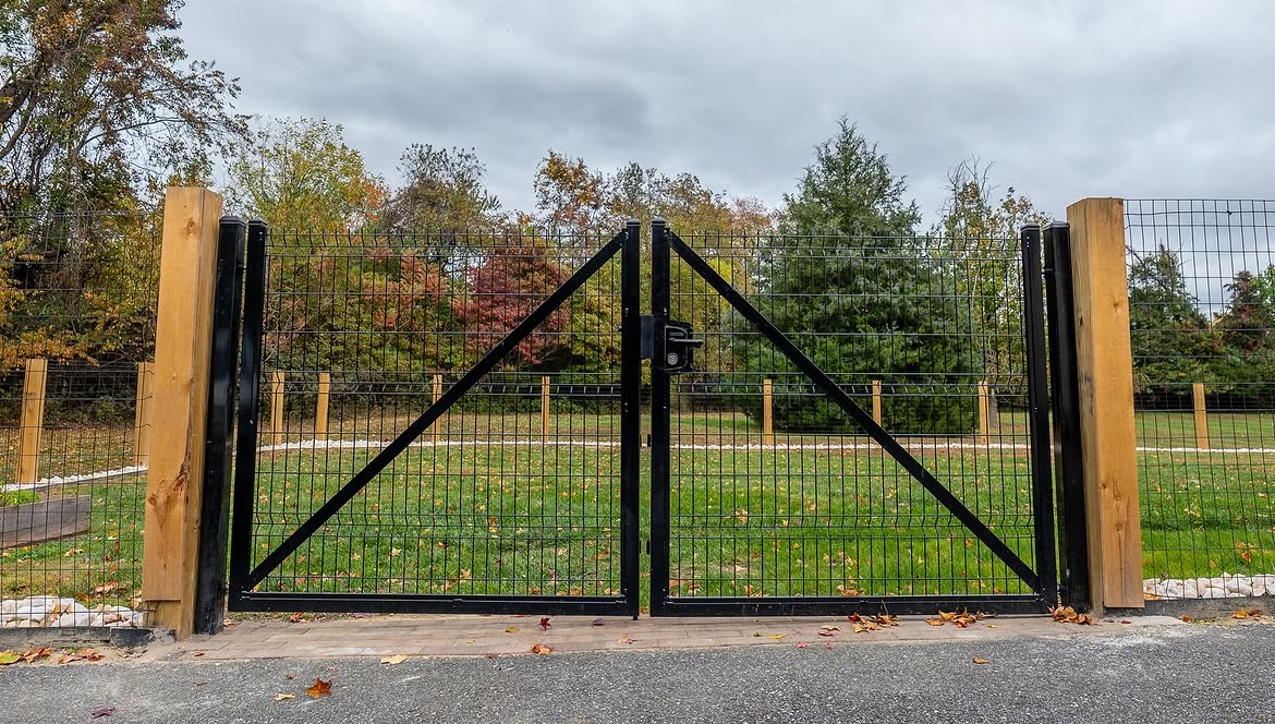 Gate and fence view of custom wire fence on cedar posts in Townsend, DE