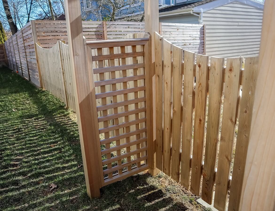 Gate and fence view of custom wood fence in Delaware