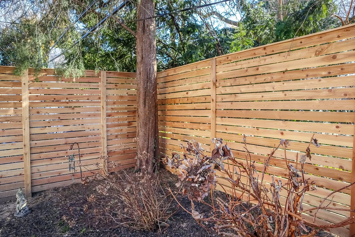 Property line view of horizontal cedar privacy fence in Wilmington, DE