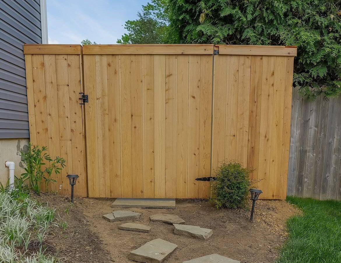 Gate and fence view of red cedar cap and trim fence in Delaware