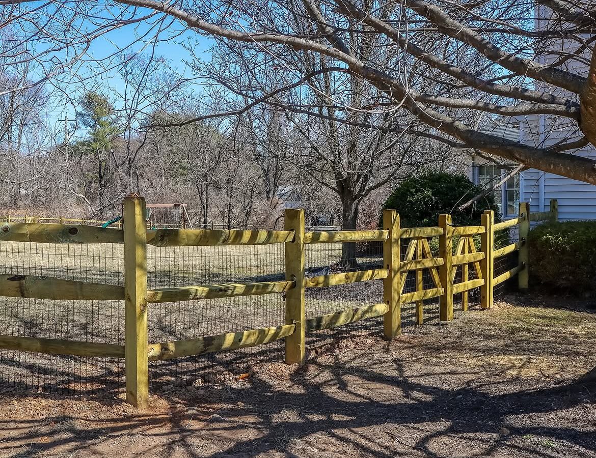 Angled view of split rail fence with wire backing in Delaware