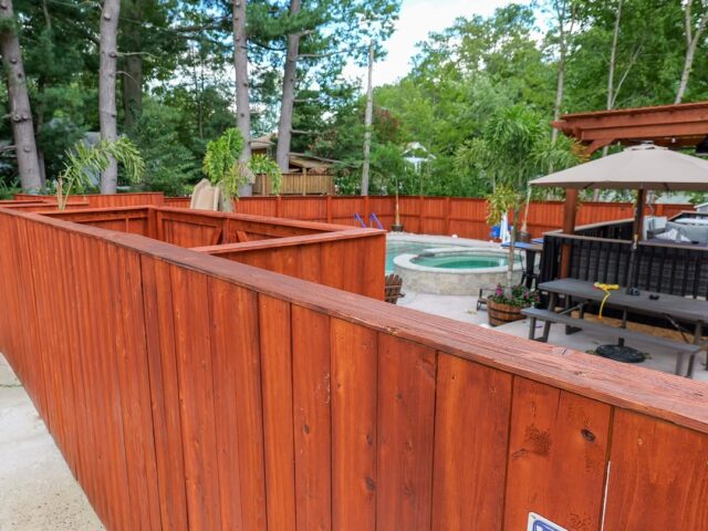 Stained Wood Fence Around Spa