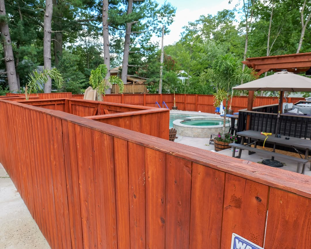 Full view of stained wood privacy fence and patio in Delaware