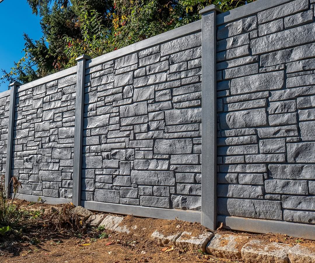 Full view of rock wall vinyl privacy fence in Delaware