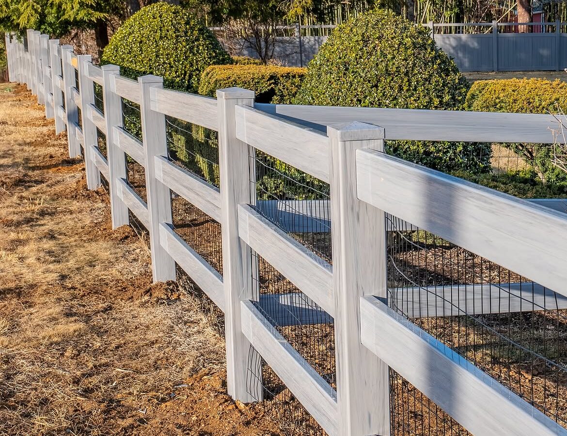 Angled view of vinyl ranch rail and privacy fence in Delaware