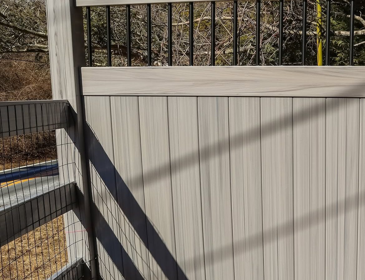 Close-up of vinyl ranch rail and privacy fence in Delaware