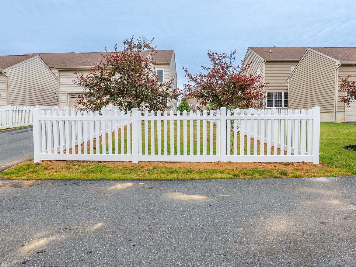Gate and fence view of white vinyl picket fence in Middletown, DE