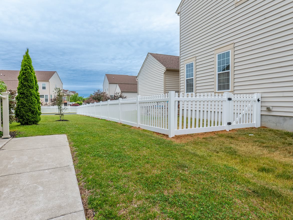 Angled view of white vinyl picket fence in Middletown, DE
