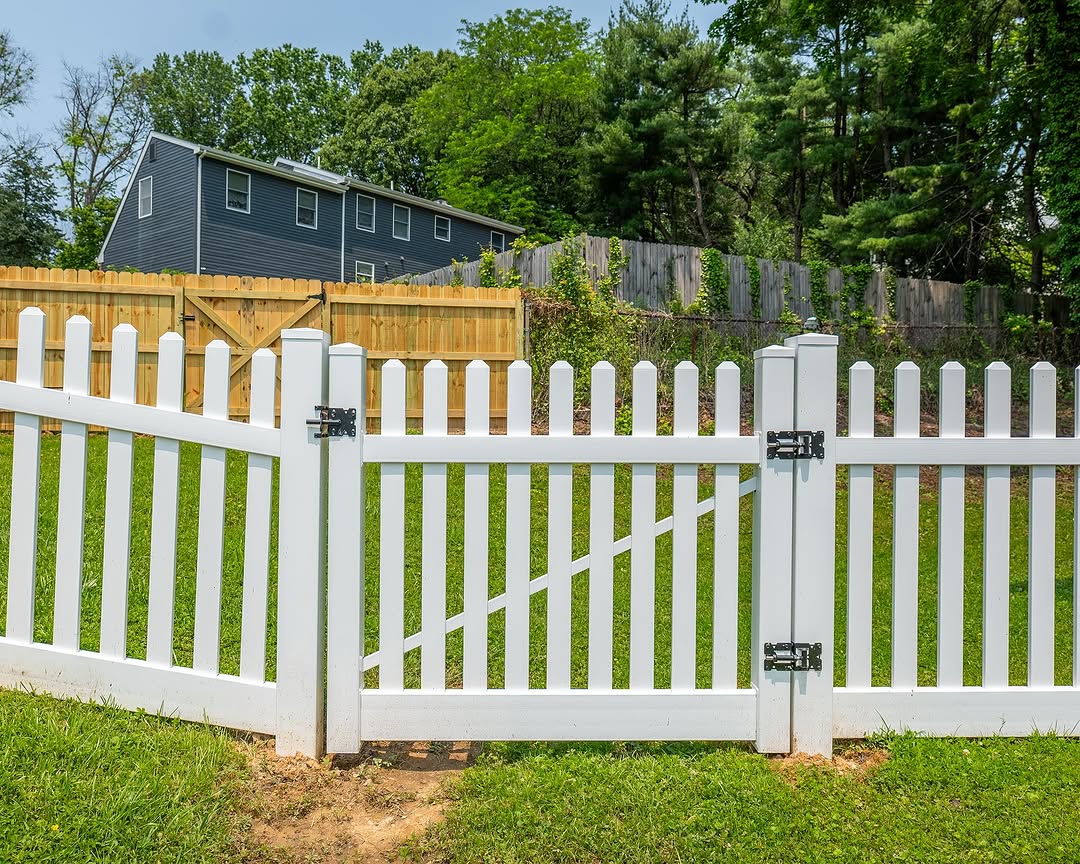 Gate detail of white vinyl picket fence and gate in Delaware
