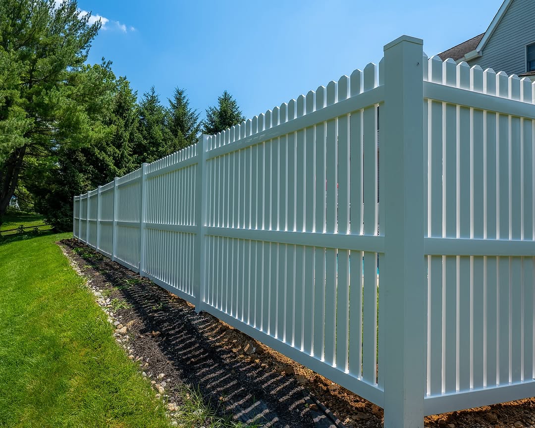 Full view of white vinyl picket top privacy fence in Delaware