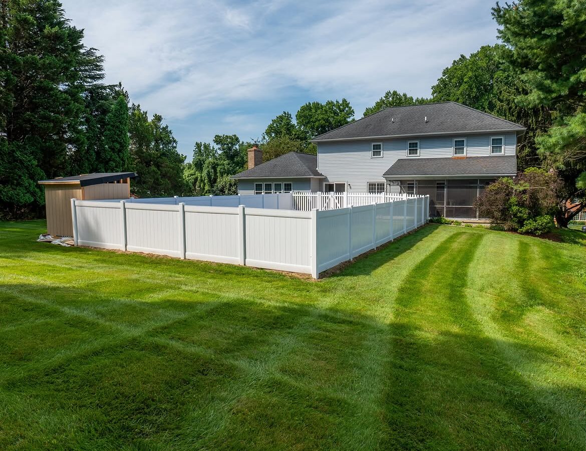Full view of white vinyl pool fence in Delaware