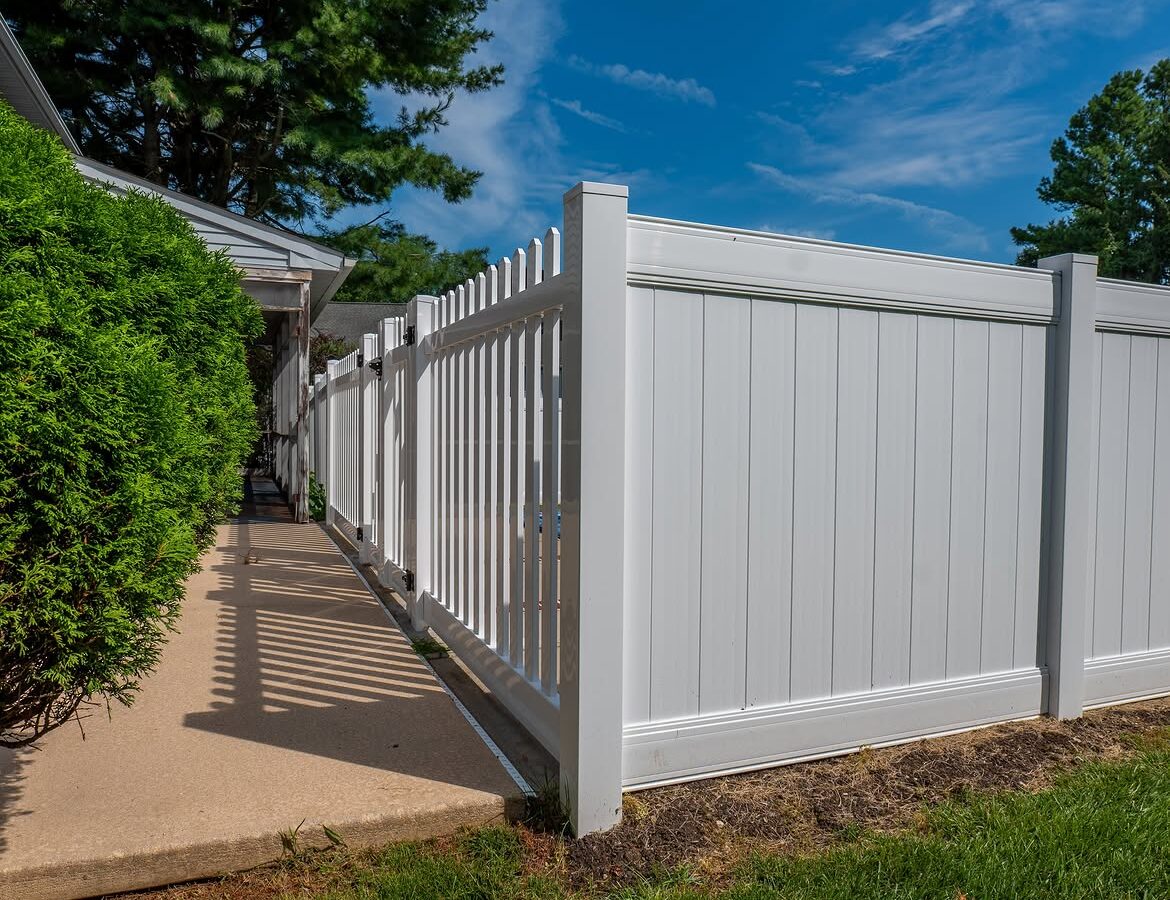 Corner detail of white vinyl pool fence in Delaware