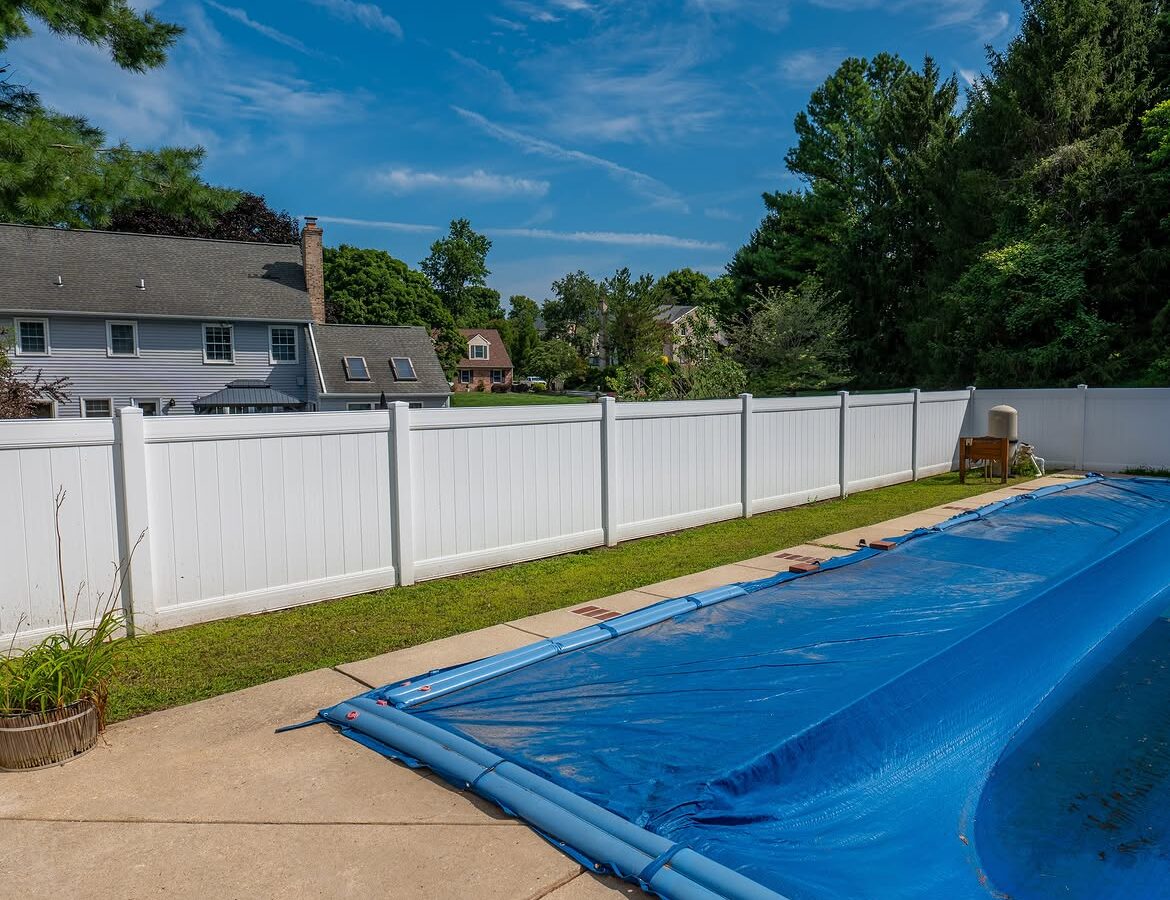 Close-up of white vinyl pool fence in Delaware