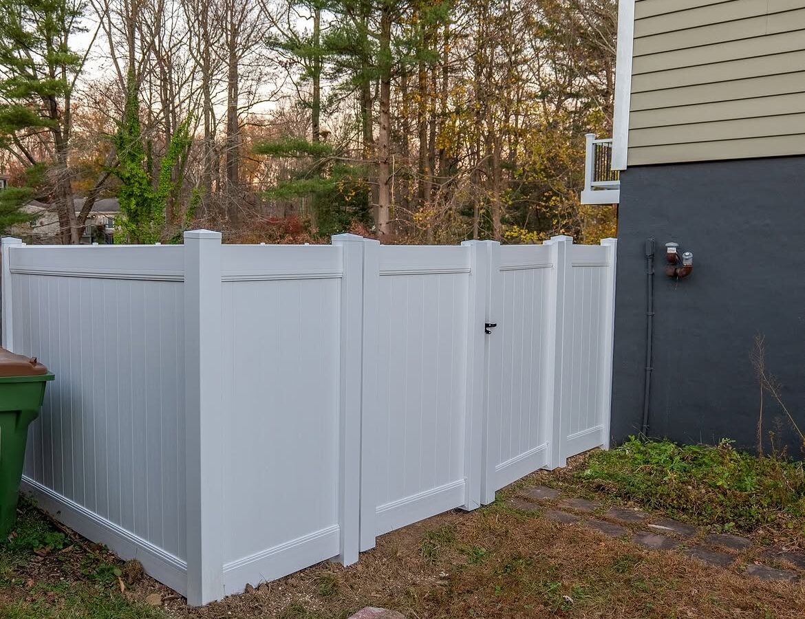 Angled view of white vinyl privacy fence in Delaware