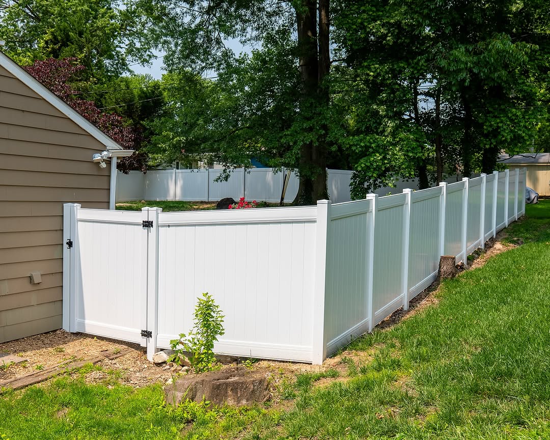 Gate detail of white vinyl privacy fence and gate in Delaware
