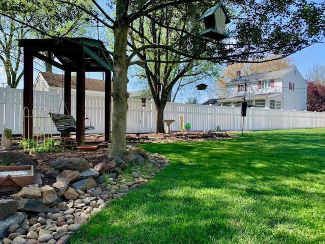 White Vinyl Privacy Fence & Landscaping