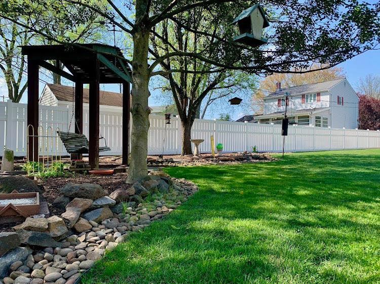 Full view of white vinyl privacy fence in Delaware