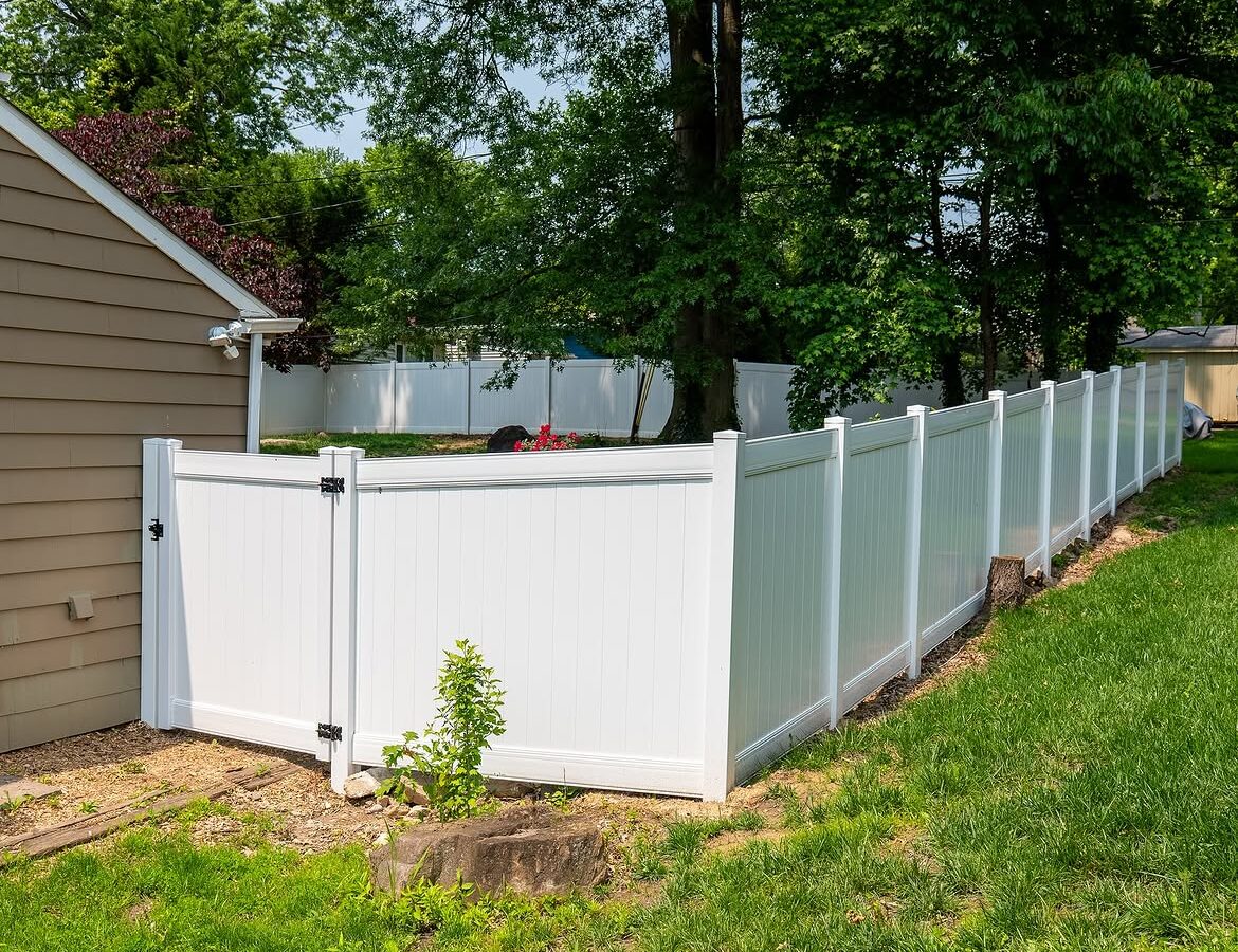 Angled view of white vinyl privacy fence in Delaware