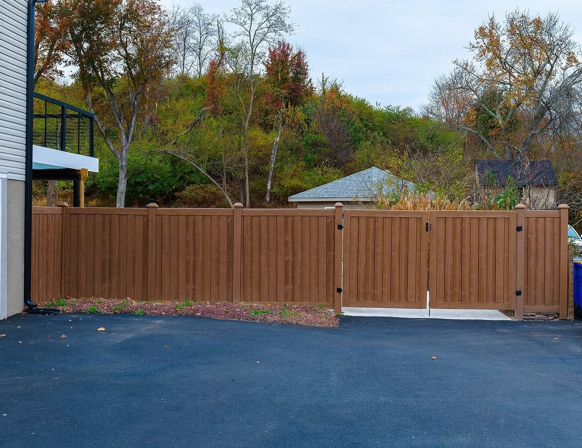 Gate detail of wood grain vinyl driveway gate in Delaware