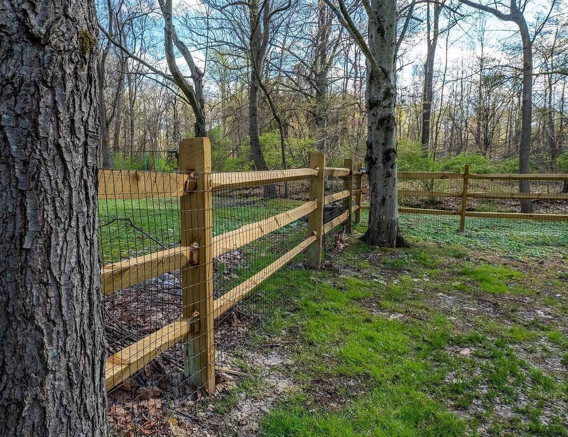 Angled view of wood post-and-rail fence in Delaware